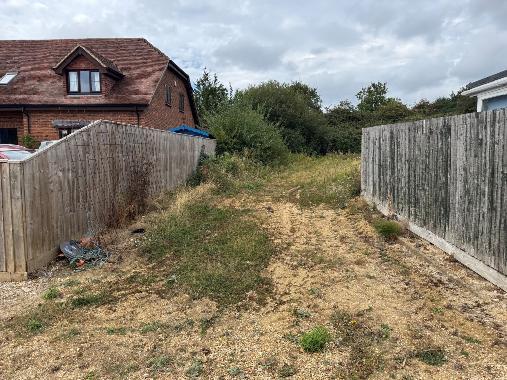 Lot: 73 - LAND WITH CONSENT FOR TWO THREE-BEDROOM HOLIDAY BUNGALOWS - View of access from Ashey Park